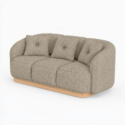 Canapé beige à revêtement texturé et base arrondie