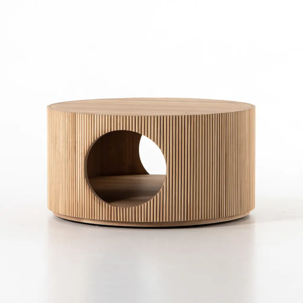 Table basse ronde beige à pourtour cannelé et ouverture circulaire