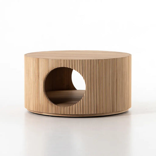 Table basse ronde beige à pourtour cannelé et ouverture circulaire